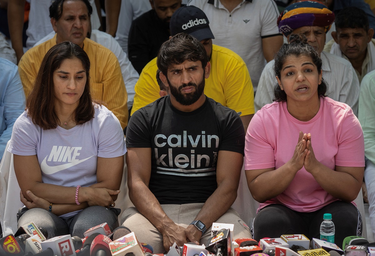 Indian wrestlers Vinesh Phogat, Bajrang Punia, and Sakshi Malik address a news conference during their sit-in protest demanding arrest of Wrestling Federation of India (WFI) chief, who they accuse of sexually harassing female players, in New Delhi, in April 2023