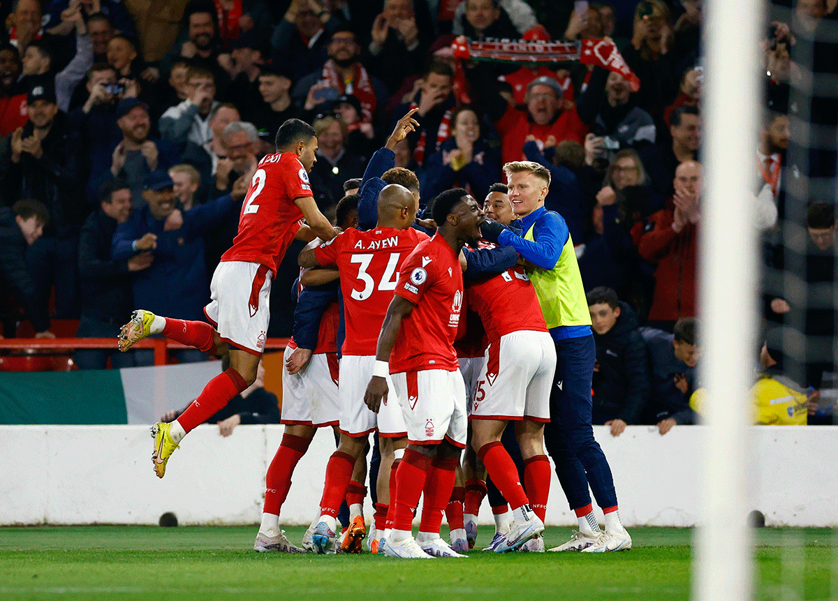 Nottingham Forest players celebrate after Morgan Gibbs-White scores their third goal against Brighton & Hove Albion at The City Ground, Nottingham 