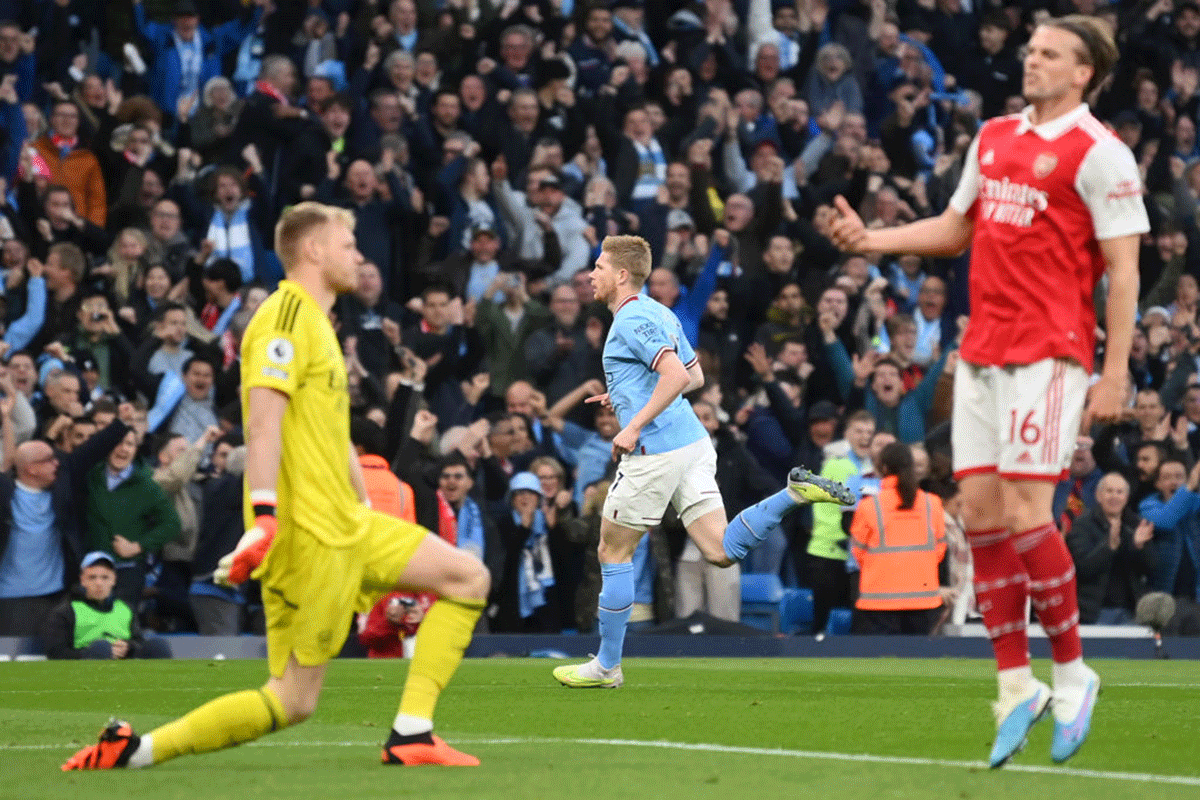 Manchester City's Kevin De Bruyne celebrates after scoring the team's first goal against Arsenal FC at Etihad Stadium in Manchester on Wednesday.