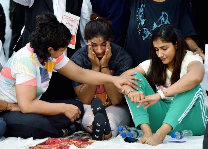 Sakshi Malik, Vinesh Phogat and Sangeeta Phogat break down during the sit-in protest on Wednesday