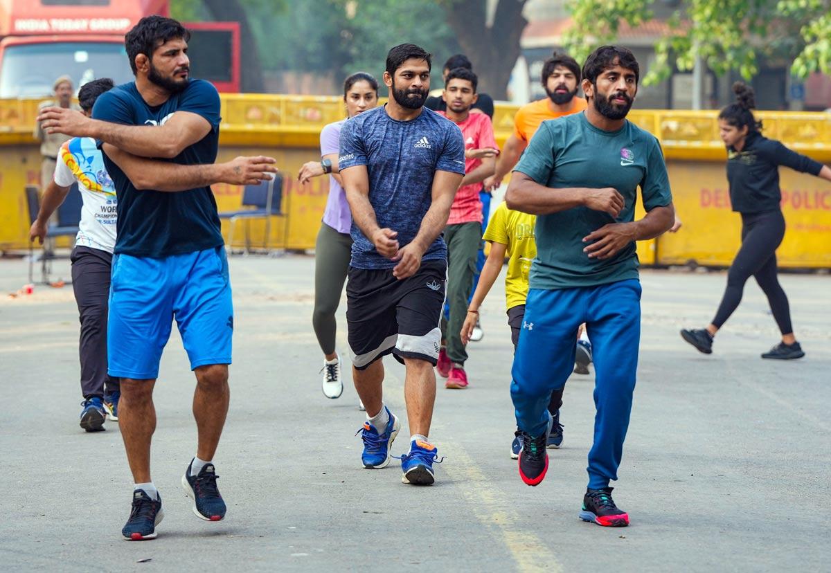 Wrestlers warm-up ahead of another intense day of protest