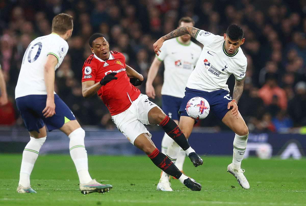 Manchester United's Anthony Martial in action with Tottenham Hotspur's Cristian Romero 