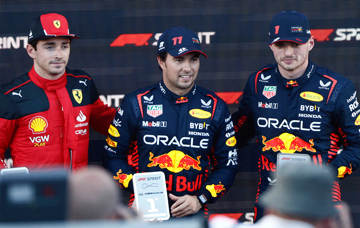 Red Bull's Sergio Perez celebrates on the podium after winning the sprint alongside second place Ferrari's Charles Leclerc and third place Red Bull's Max Verstappen at the Azerbaijan Grand Prix in Baku City Circuit, Baku, Azerbaijan, on Saturday. 