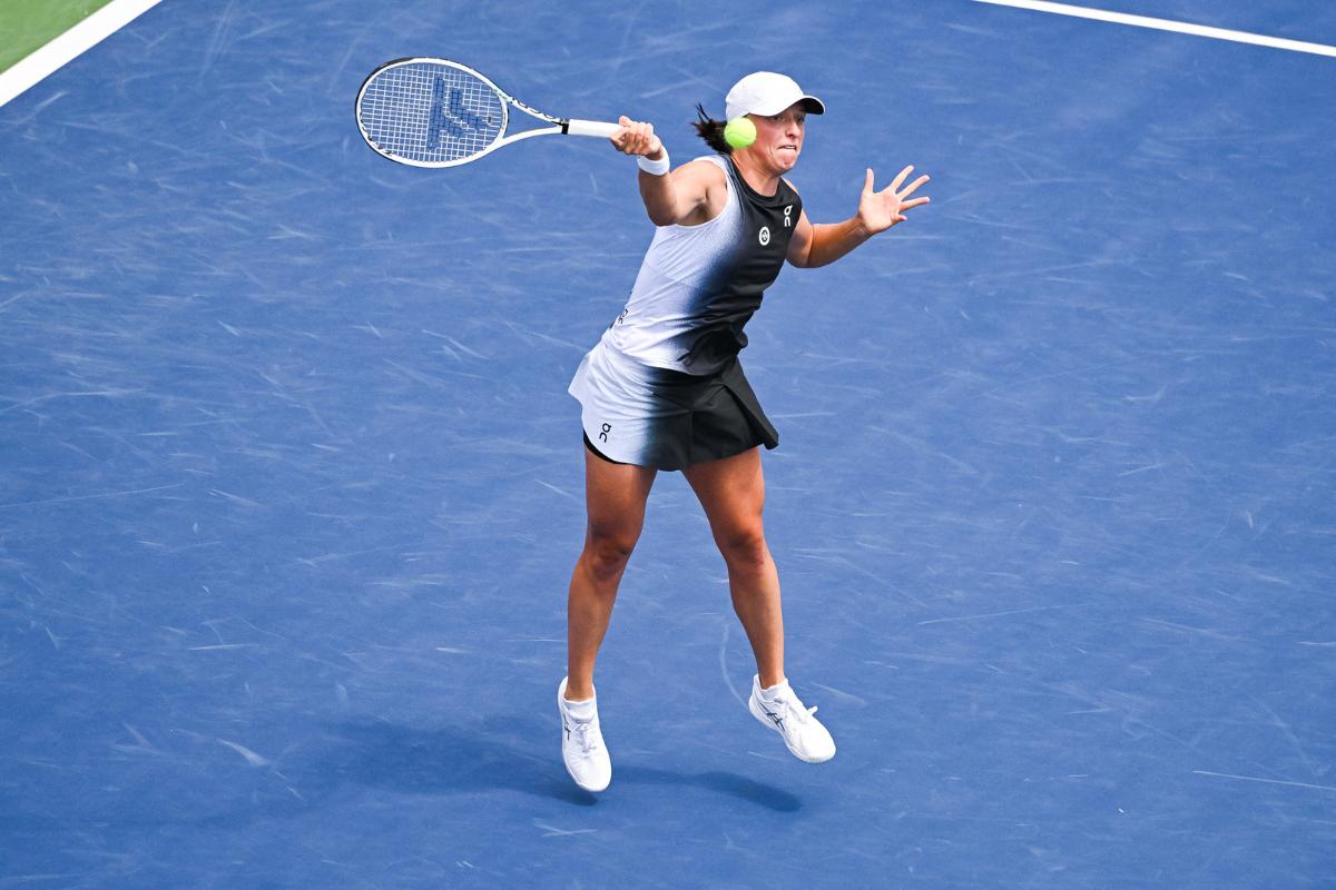 Poland's Iga Swiatek plays a return against Czech Republic's Karolina Muchova during their third round match of the Montreal Open in Quebec at IGA Stadium on Thursday