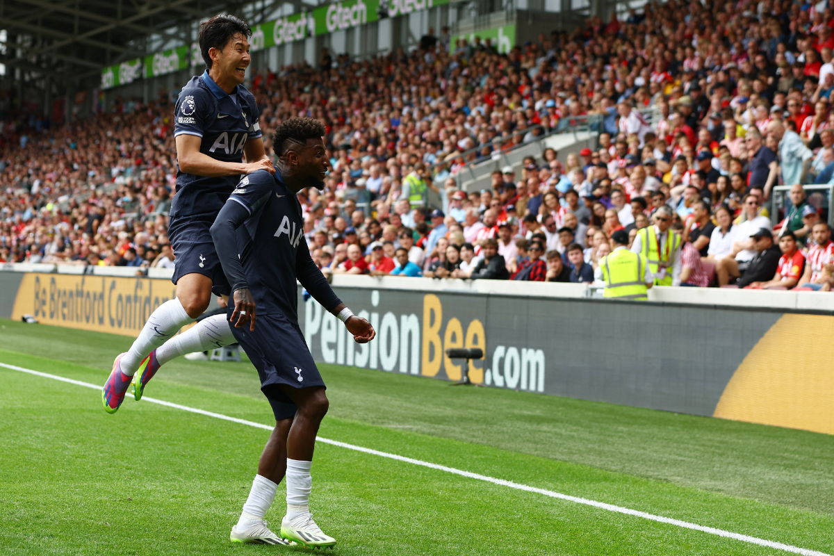 Tottenham Hotspur's Emerson Royal celebrates scoring their second goal with Son Heung-min during their match against Brentford at Brentford Community Stadium, London 