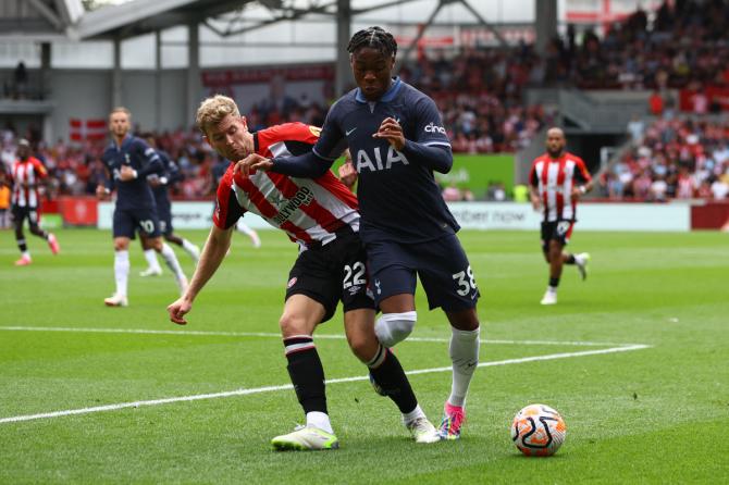 Tottenham Hotspur's Destiny Udogie and Brentford's Nathan Collins vie for the ball 