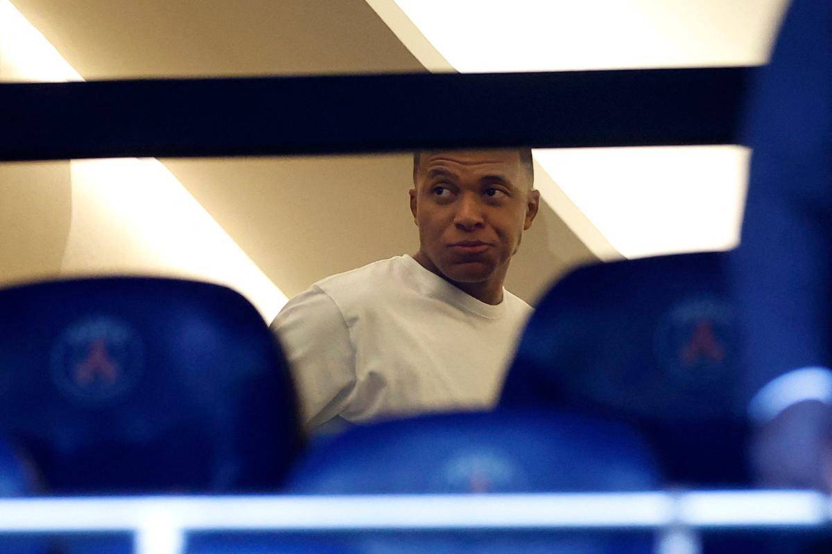 Paris St Germain's Kylian Mbappe is seen in the stands ahead of the club's Ligue 1 season opener against Lorient on Saturday. Mbappe was also left out of PSG's squad for last month's pre-season tour of Asia. He has been one of several players tipped to leave the Parc des Princes in the transfer window, which closes on September 1.