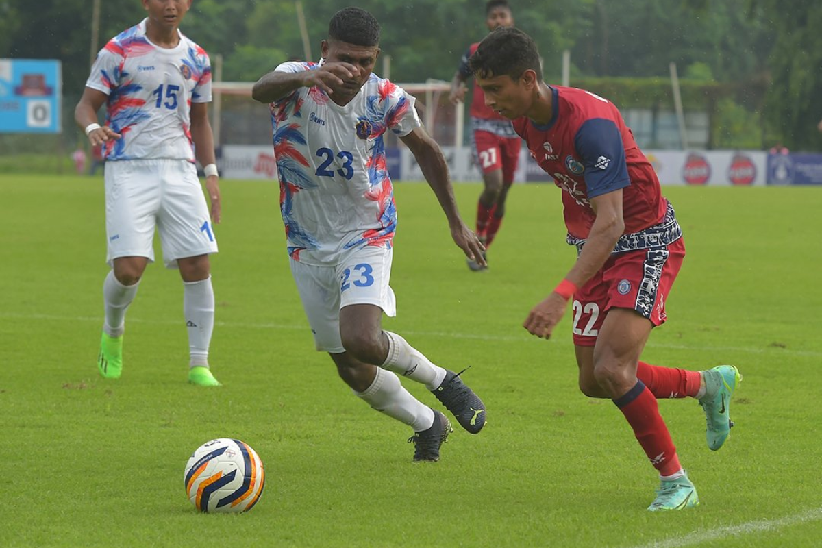 Jamshedpur FC's Ashley Koli (right) vies for possession with an Indian Navy player during their Durand Cup match in Kolkata on Thursday