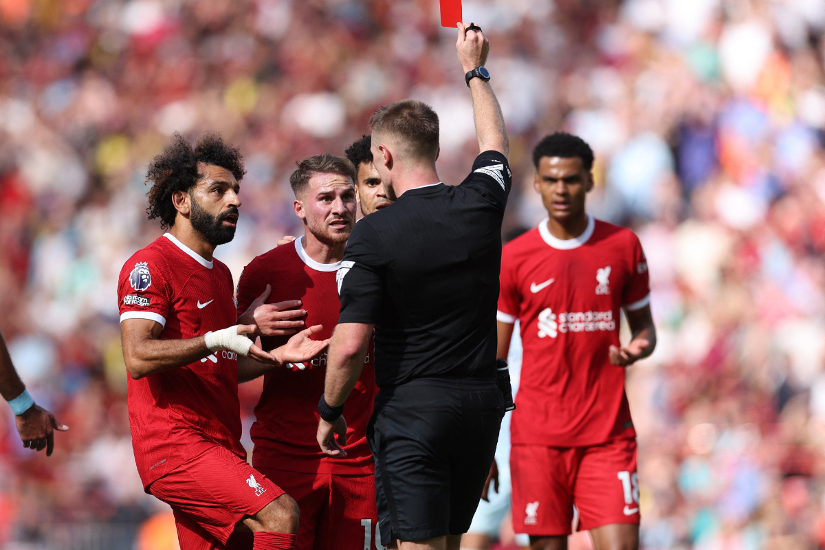 Liverpool's Alexis Mac Allister is shown a red card by referee Thomas Bramall 