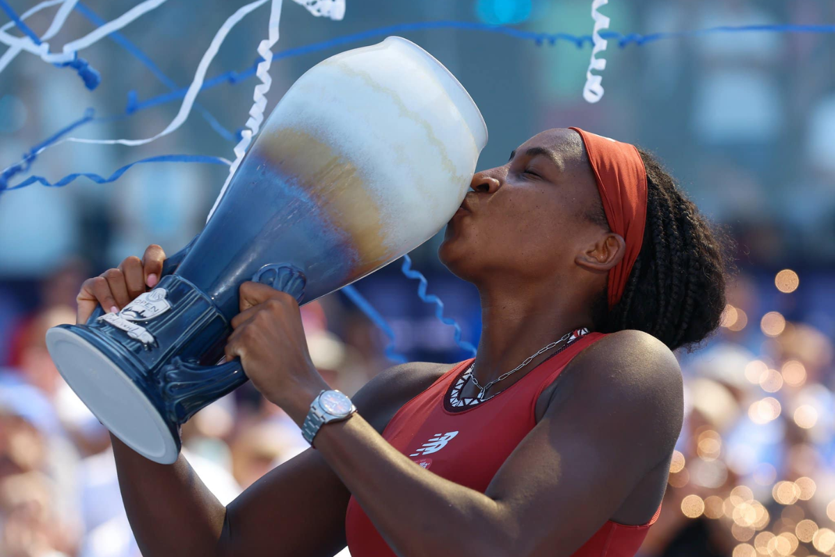 Coco Gauff celebrates with the trophy after winning the Cincinnati Open final