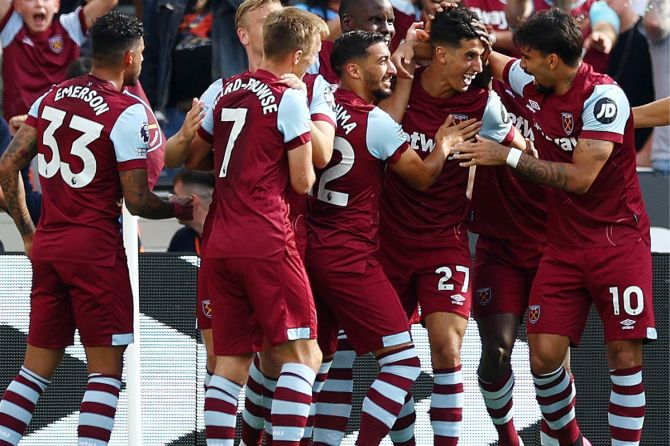 West Ham's Nayef Aguerd celebrates with teammates after scoring the opening goal against Chelsea at  London Stadium, London on Sunday