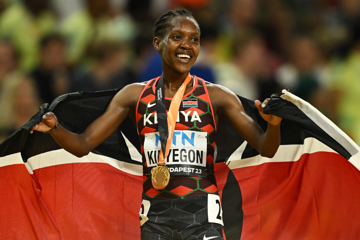 Kenya's Faith Kipyegon celebrates with the gold medal after winning the Women's 1500m final