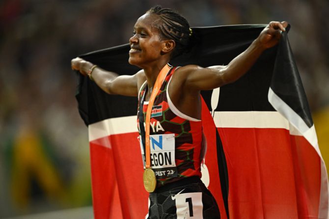 Kenya's Faith Kipyegon celebrates after winning the gold medal in the women's 5000m final 