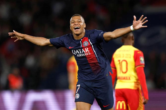 Paris St Germain's Kylian Mbappe celebrates scoring their third goal against RC Lens during their Ligue 1 match at Parc des Princes, Paris, France 