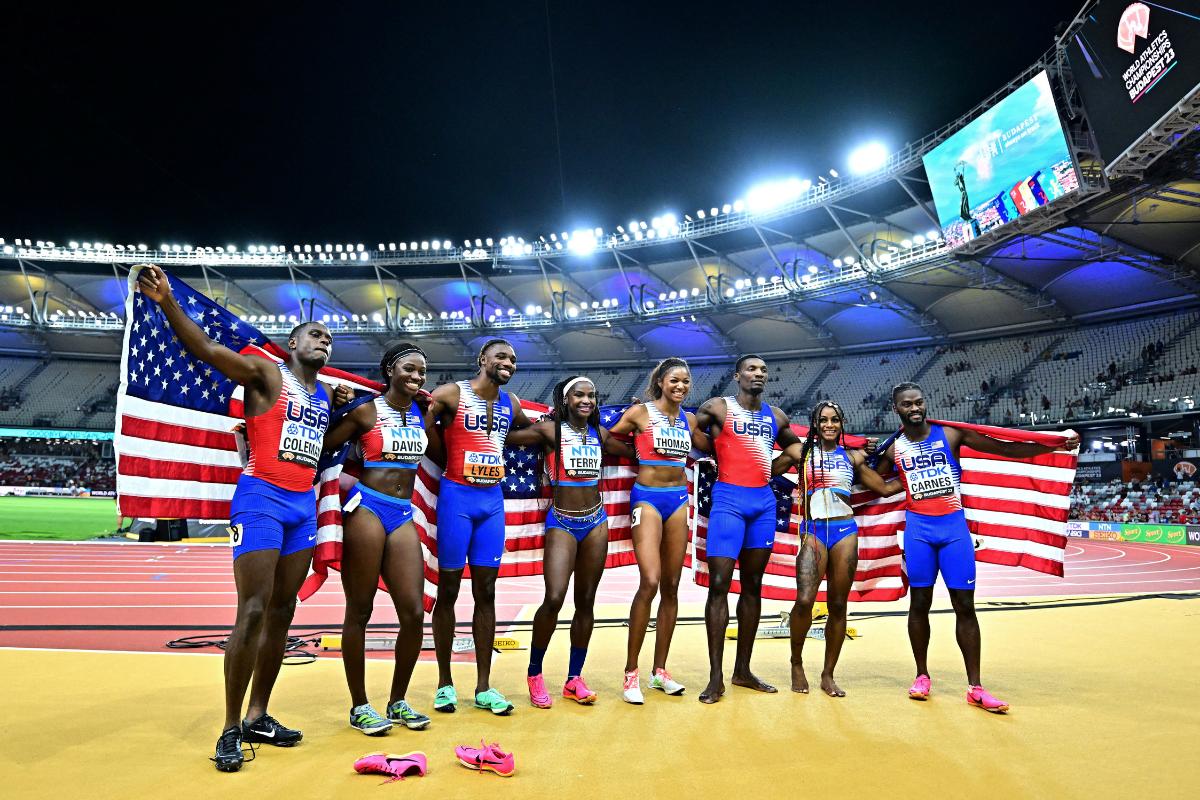 The USA's men and women's 4x100m relay gold medalists Tamari Davis, Twanisha Terry, Gabrielle Thomas, Sha'carri Richardson, Christian Coleman, Fred Kerley, Brandon Carnes and Noah Lyles celebrate after the finals 