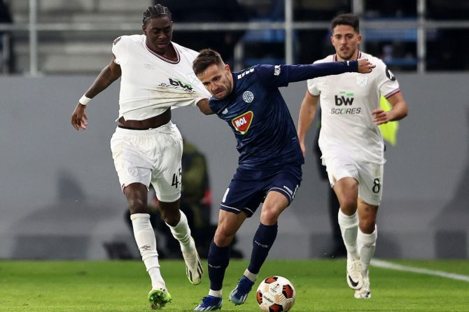 TSC Backa Topola's Nemanja Petrovic in action with West Ham United's Divin Mubama during their Europa League Group A match at FK TSC Stadium, Backa Topola, Serbia