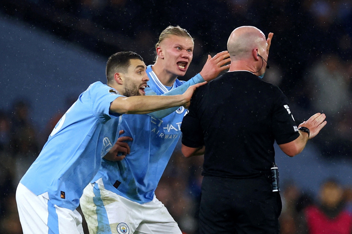 Manchester City's Erling Braut Haaland and Mateo Kovacic remonstrate with referee Simon Hooper late in the game against Tottenham Hotspur, on December 3, after he stopped play when Jack Grealish was through on goal for a foul on Haaland in the build-up, having previously waved play-on. 
