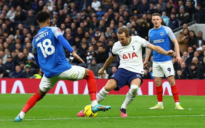Harry Kane curls the ball into the Portsmouth goal to take his Tottenham tally to 265 goals, at Tottenham Hotspur Stadium, London.
