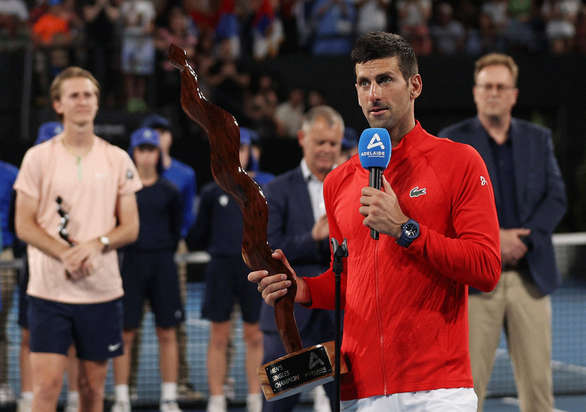 Serbia's Novak Djokovic makes a speech as he holds the trophy after winning the Adelaide International against USA's Sebastian Korda at the Memorial Drive Tennis Club, Adelaide. Victory also helped Djokovic go level with his great rival Rafael Nadal on 92 ATP singles titles in the open era, with only Ivan Lendl (94), Roger Federer (103) and Jimmy Connors (109) ahead of the duo.