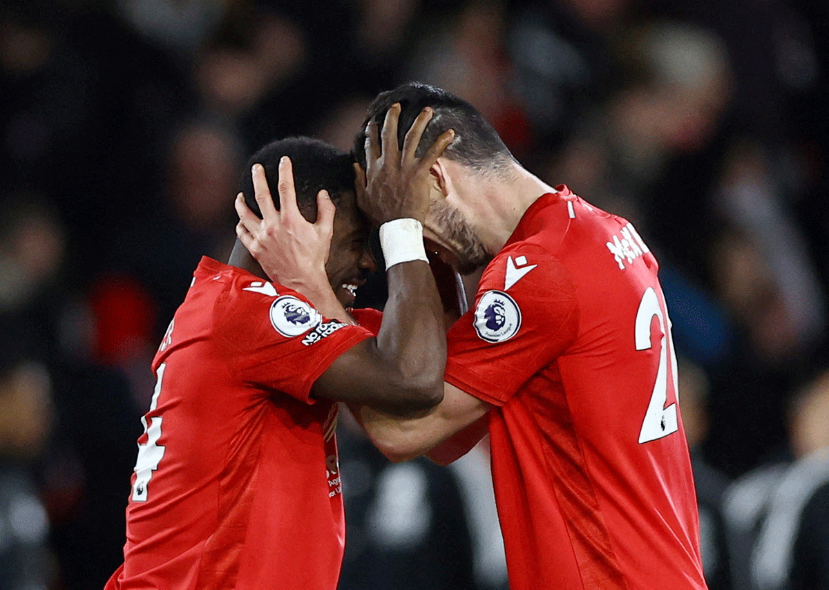 Nottingham Forest's Serge Aurier and Scott McKenna celebrate after the match against Leicester