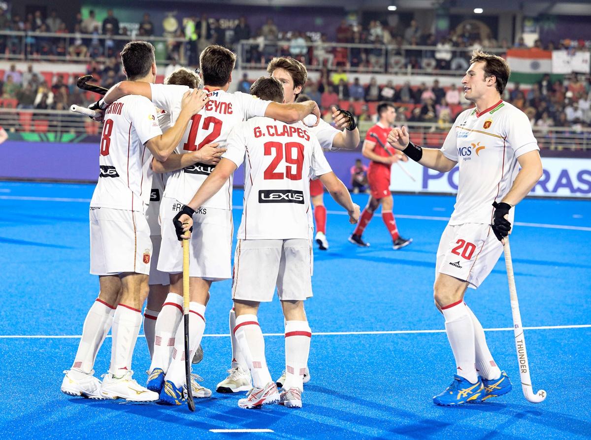 Spain's players celebrate a goal against Wales in the Pool D match.