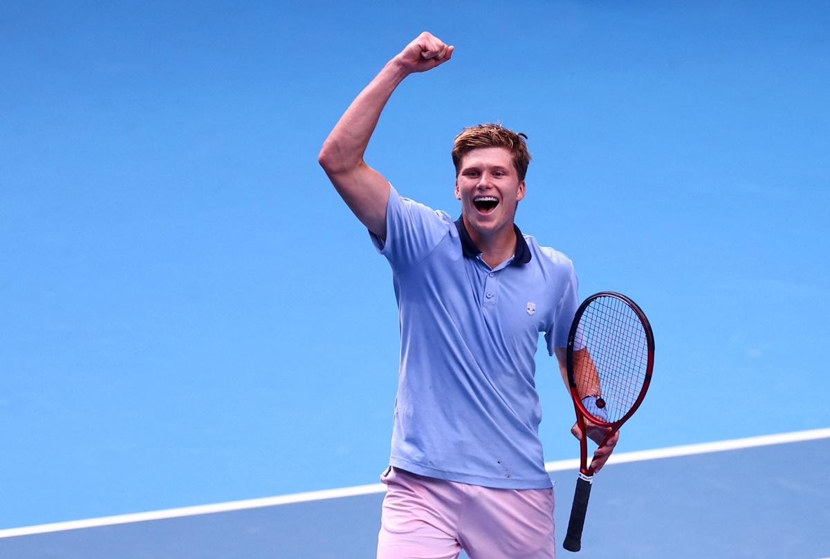 Jenson Brooksby of the United States celebrates winning his Australian Open second round match against Norway's Casper Ruud at Melbourne Park on Thursday.