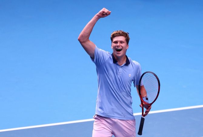 Jenson Brooksby of the United States celebrates winning his Australian Open second round match against Norway's Casper Ruud at Melbourne Park on Thursday.