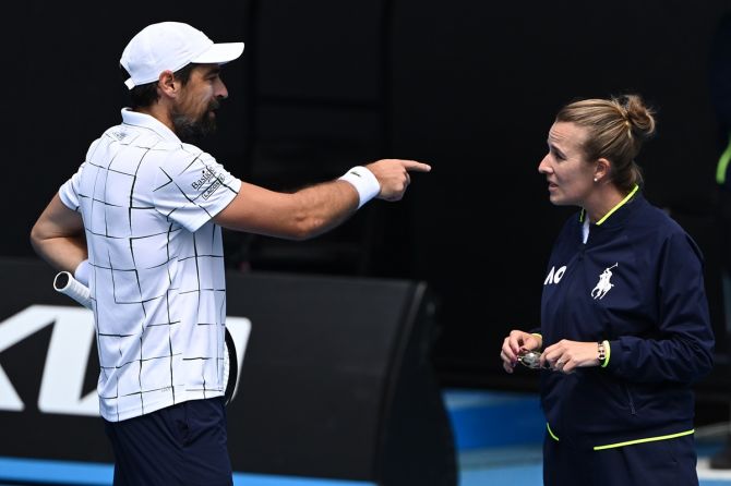 France's Jeremy Chardy argues with chair umpire Miriam Bley during his match against Great Britain's Daniel Evans.