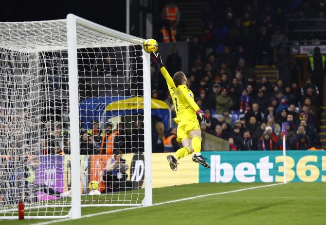 Manchester United goalkeeper David de Gea stretches fully but is unable to prevent Michael Olise's free-kick from finding the net in the dying minutes of the Premier League match against Crystal Palace, at Selhurst Park, London, on Wednesday.