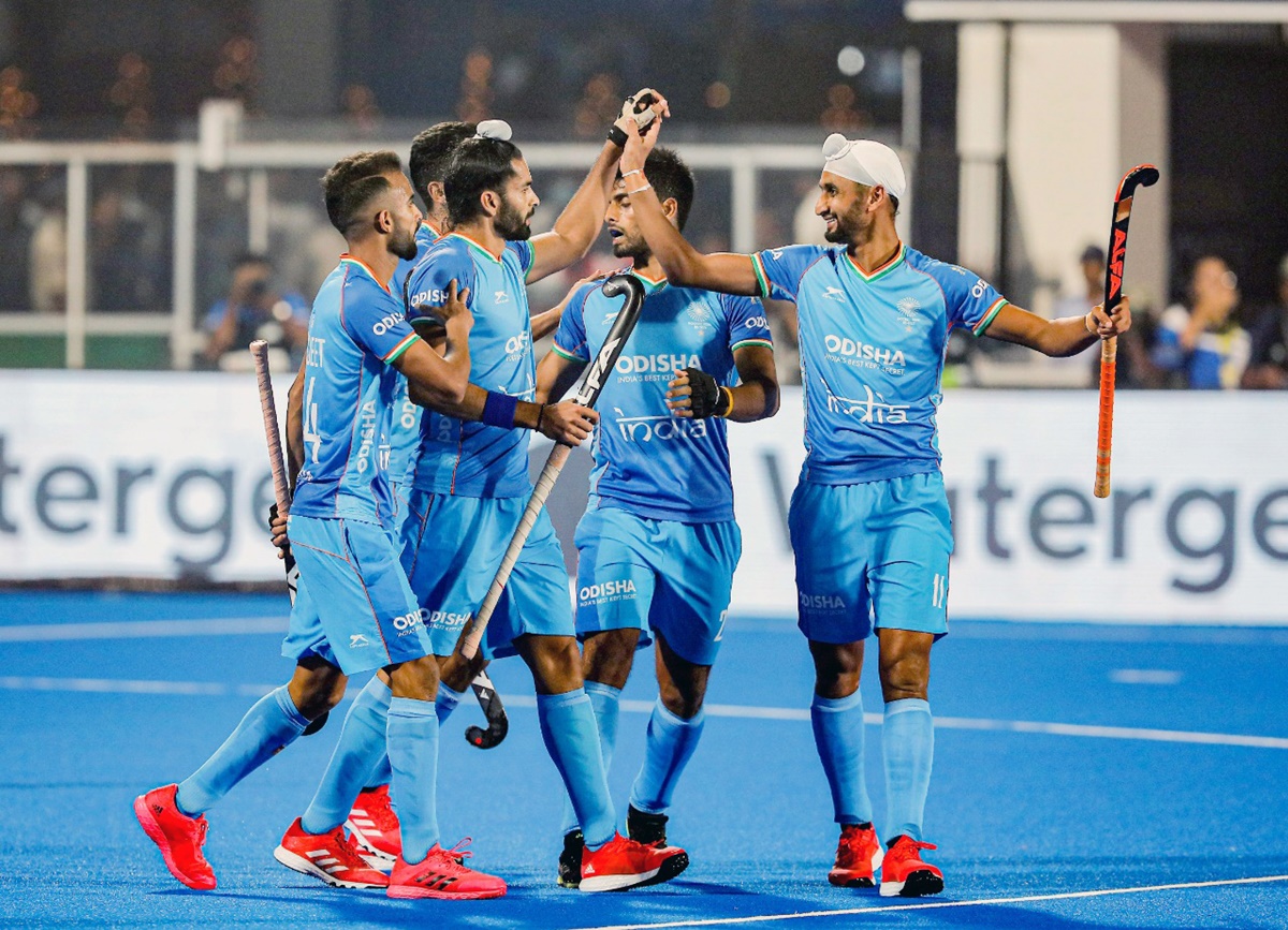 India's players celebrate a goal against Wales in the men's hockey World Cup match.