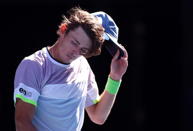 Australia's Alex de Minaur reacts as he walks off the court after winning his third round match against France's Benjamin Bonzi.