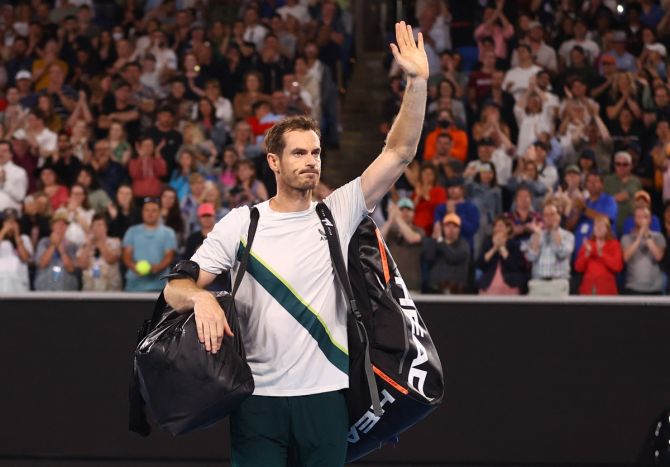 Andy Murray waves to the crowd as he walks back after losing to Roberto Bautista-Agut.