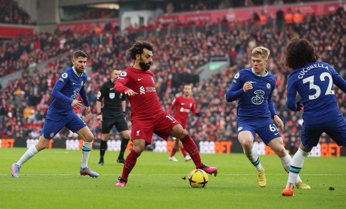 Liverpool's Mohamed Salah is chased by a host of Chelsea players as he breaks through during the Premier League match at Anfield, Liverpool, on Saturday.