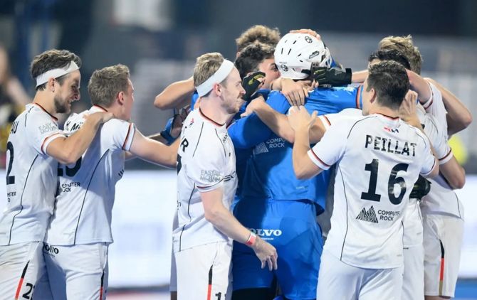 Germany's players celebrate with goalkeeper Alexander Stadler, who brought off many saves, after the men's hockey World Cup quarter-final against England, in Bhubaneswar, on Wednesday.