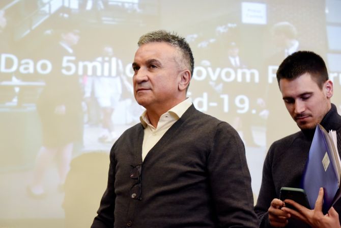 Novak Djokovic's father Srdjan and brother Djordje at a news conference in Belgrade, Serbia.