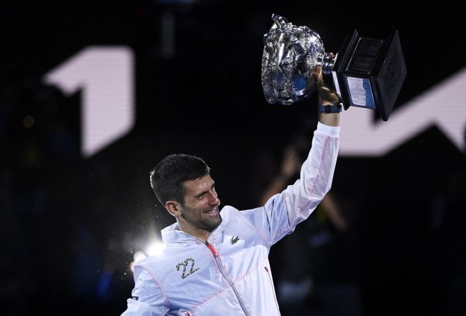 Novak Djokovic celebrates with the Norman Brookes Challenge Cup after victory over Greece's Stefanos Tsitsipas in the final of the Australian Open on Sunday.