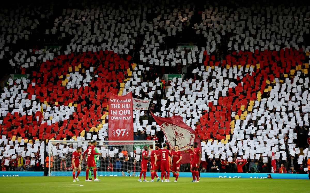 General view as Liverpool fans hold up signs in reference to the 97 victims of the Hillsborough disaster inside the stadium before the match