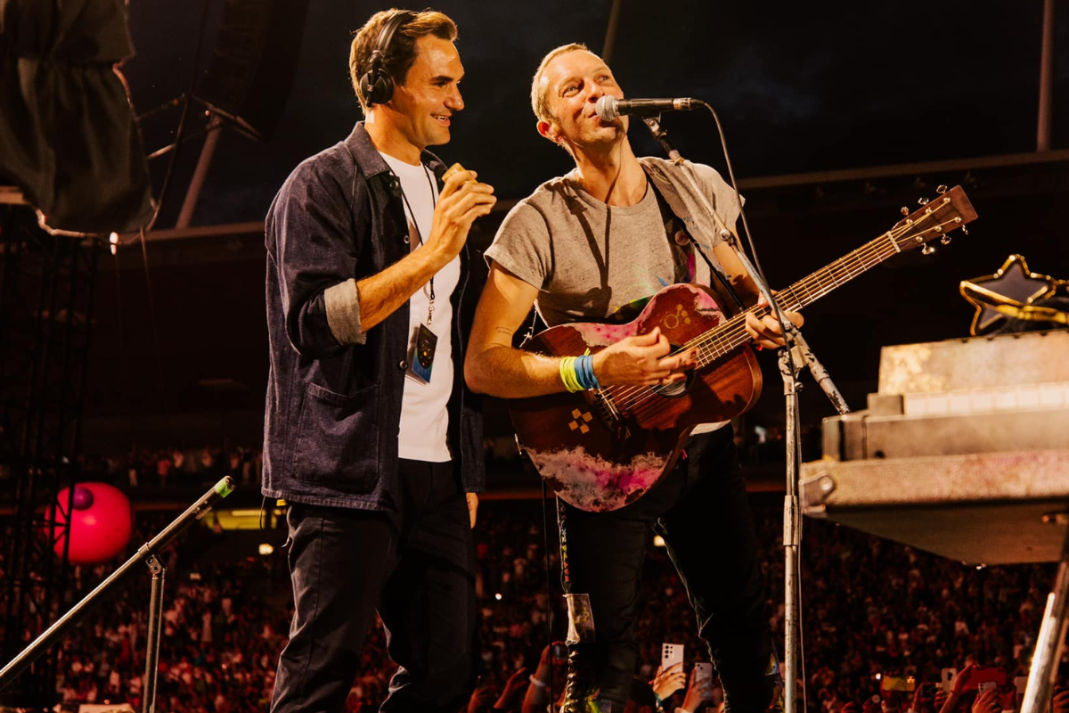 Roger Federer joins Coldplay frontman Chris Martin on stage during the band's concert in Zurich on Sunday