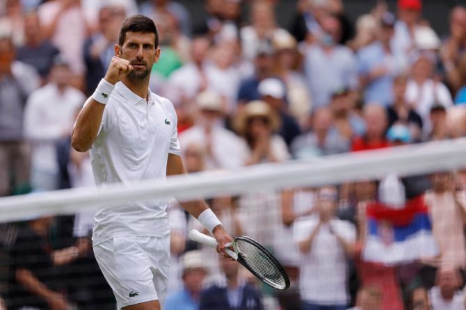 Serbia’s Novak Djokovic celebrates after winning his first round match against Argentina’s Pedro Cachin