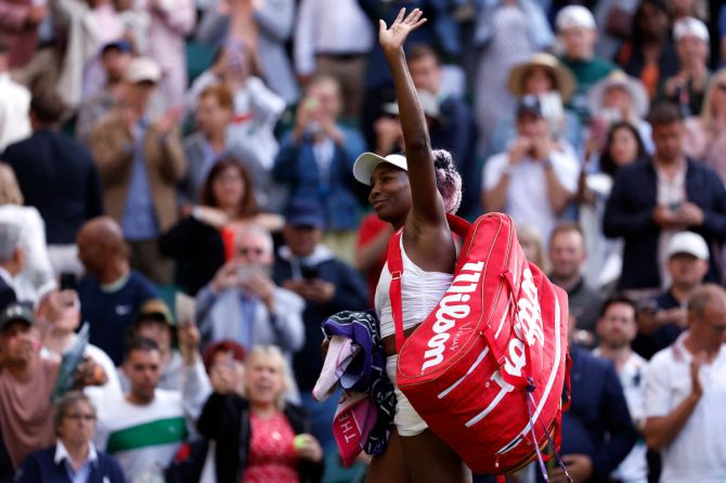 Venus Williams acknowledges the crowd after losing her first round Wimbledon match against Elina Svitolina on Monday