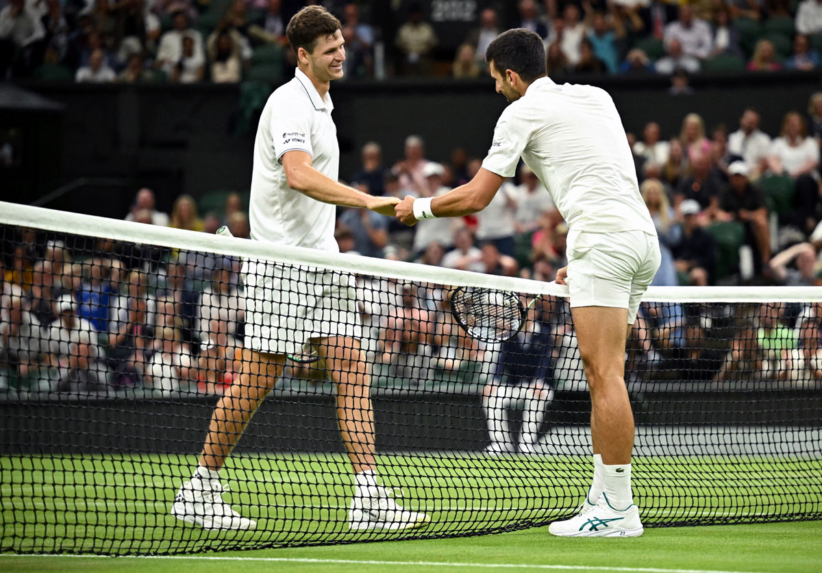 Wimbledon Djokovic in charge before play suspended Rediff Sports