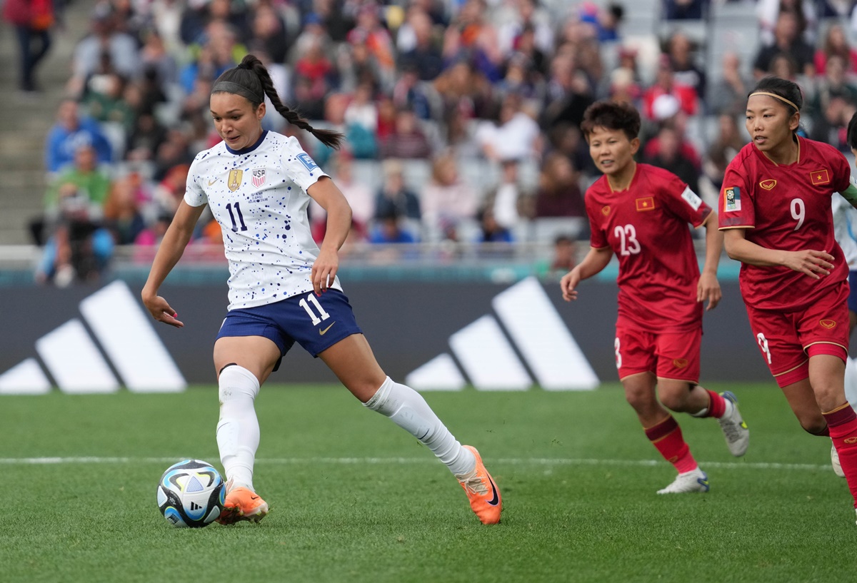 USA forward Sophia Smith (11) gets the ball past Vietnam forward Huynh Nhu (9) during the group stage match at Eden Park, Auckland, on Saturday.
