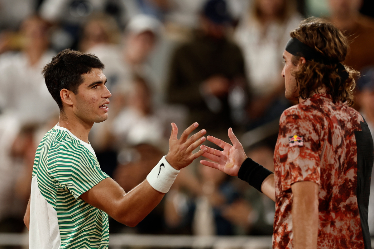 Spain's Carlos Alcaraz is congratulated by Greece's Stefanos Tsitsipas after winning his quarter final match