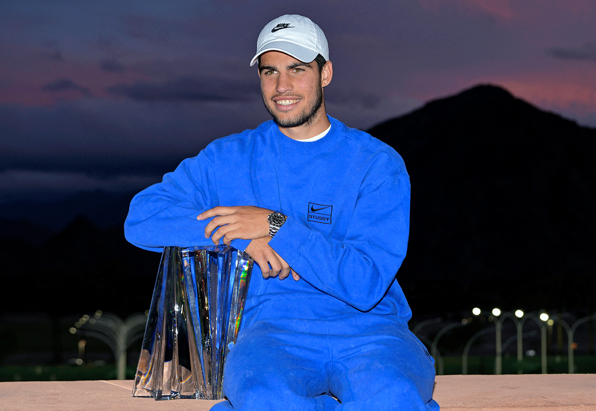 Carlos Alcaraz with the championship trophy after defeating Russia's Daniil Medvedev to win the men’s final of the BNP Paribas Open at the Indian Wells Tennis Garden, in Indian Wells, California, on Sunday
