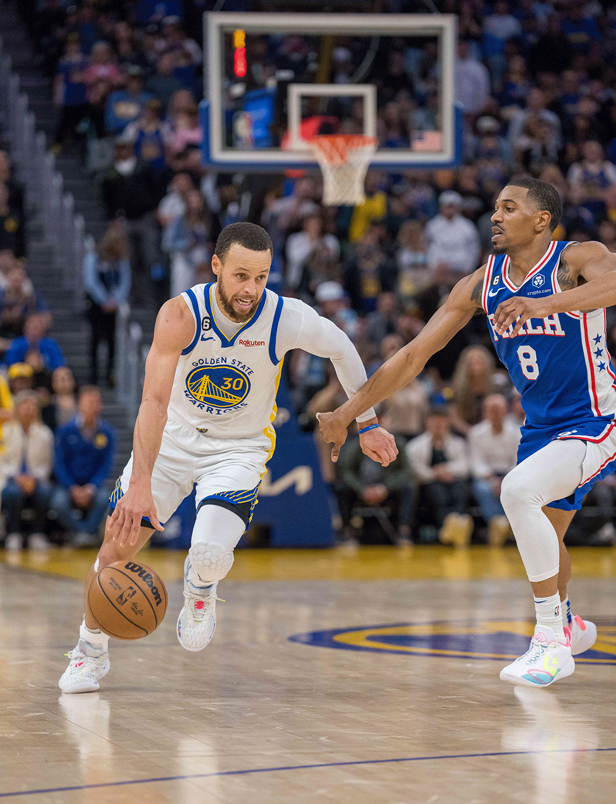 Golden State Warriors guard Stephen Curry (30) drives to the net against Philadelphia 76ers guard De'Anthony Melton (8) during the fourth quarter of their NBA game at Chase Center in San Francisco, California, on Saturday