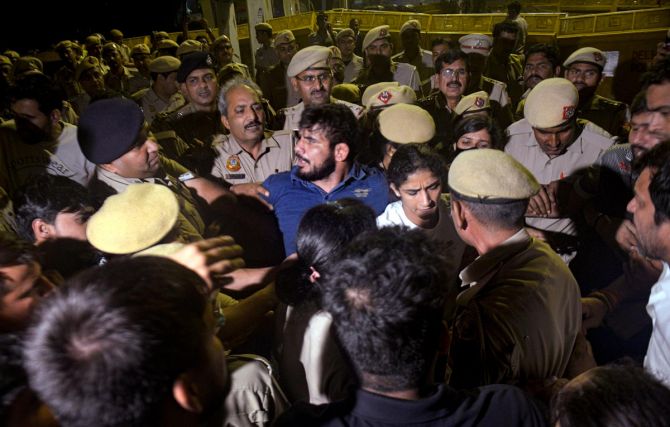 Police jostle with wrestlers after a scuffle broke out at Jantar Mantar on Wednesday