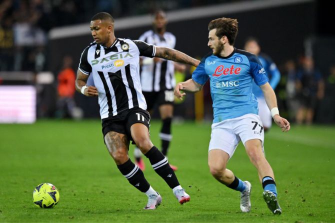 Walace of Udinese Calcio is put under pressure by Khvicha Kvaratskhelia of SSC Napoli during their Serie A match on Thursday 