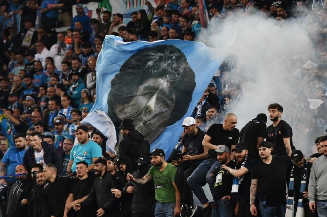 Napoli fans with a Diego Maradona flag during the match between Udinese and SSC Napoli at  Dacia Arena, Udine, Italy, on Thursday