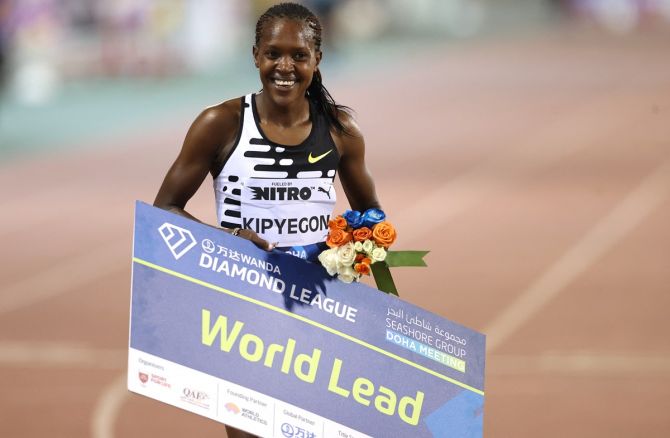 Kenya's Faith Kipyegon celebrates after winning the women's 1500 metres.