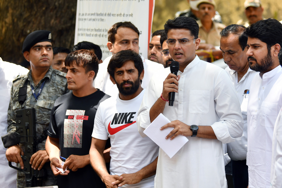 Congress leader Sachin Pilot addresses the media during as he meets the wrestlers during their ongoing protest against Wrestling Federation of India (WFI) chief Brij Bhushan Sharan Singh, at Jantar Mantar, in New Delhi on Friday.